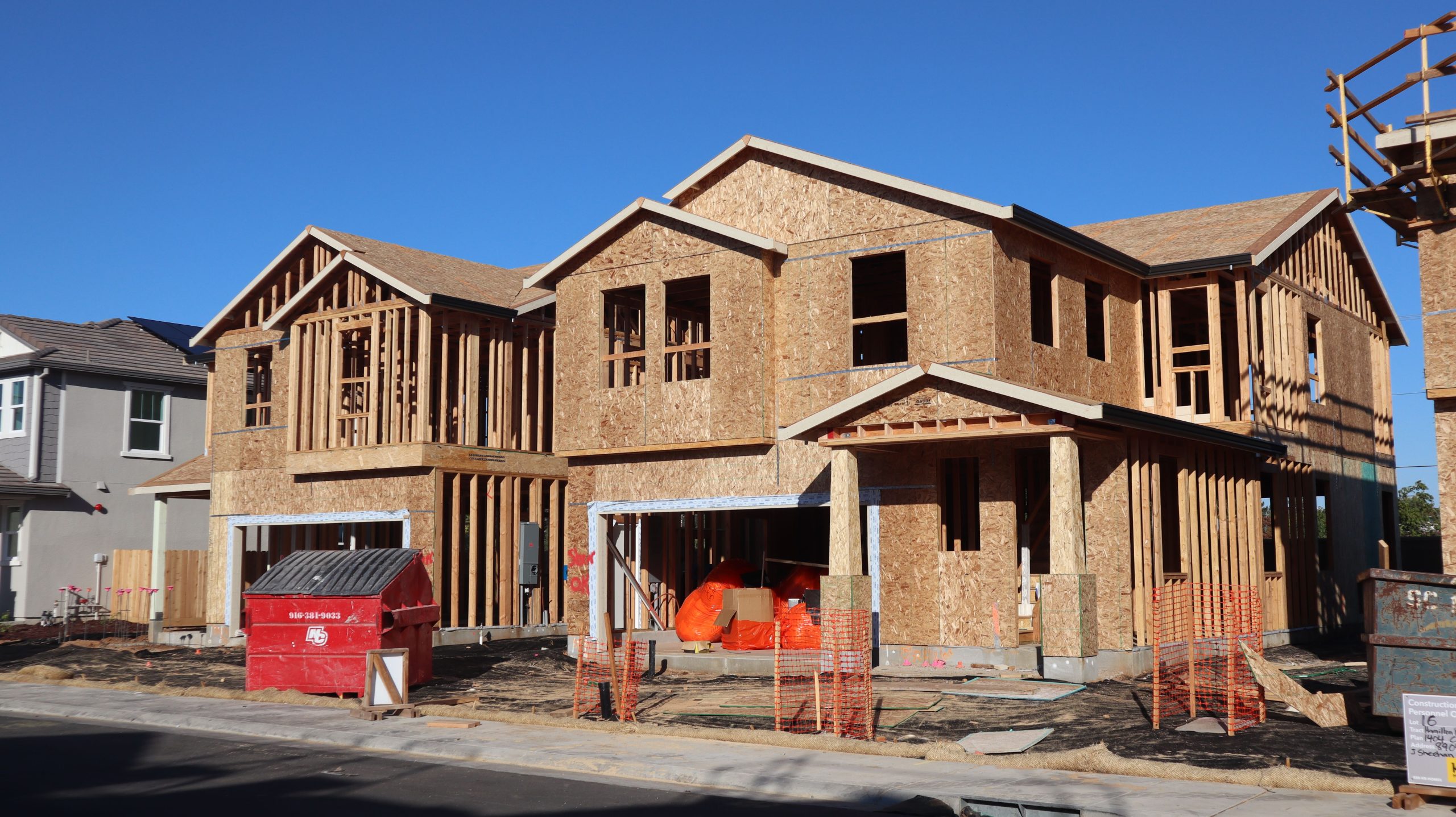 Wooden frames of new houses under construction
