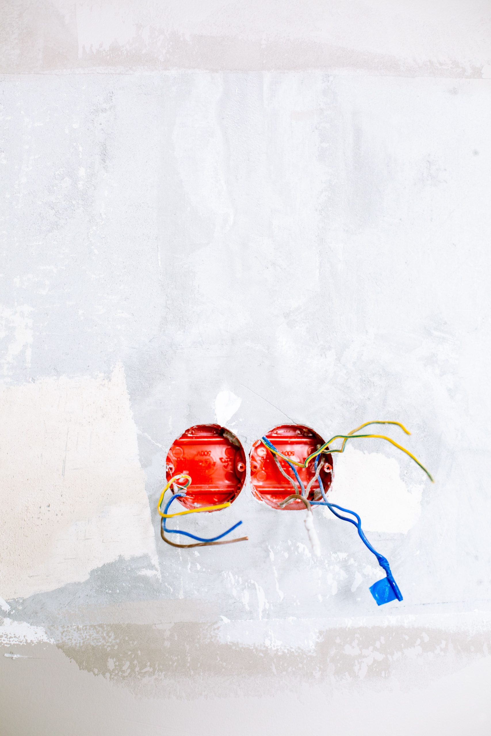 Close-up of electrical wiring and sockets in a home renovation project.